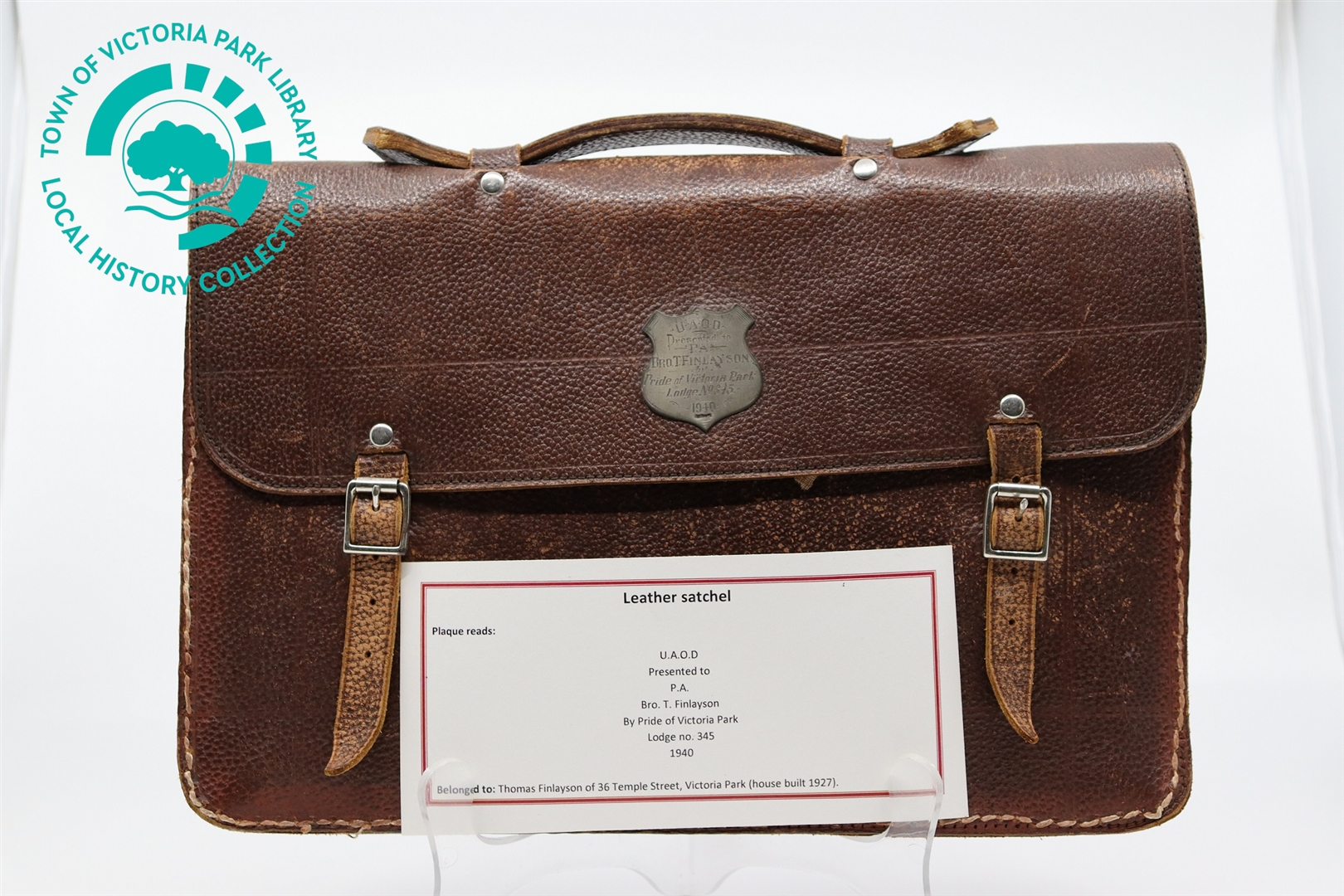 Front of Mr T. Finlayson's satchel with display note. Image