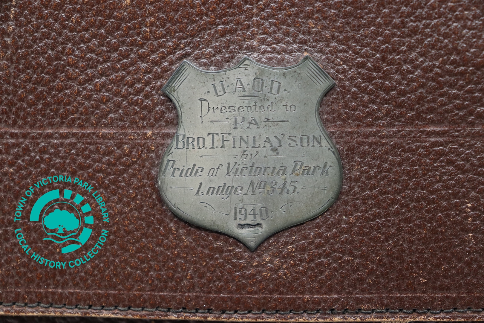 Close-up of engrave dedication on Mr T. Finlayson's leather satchel Image