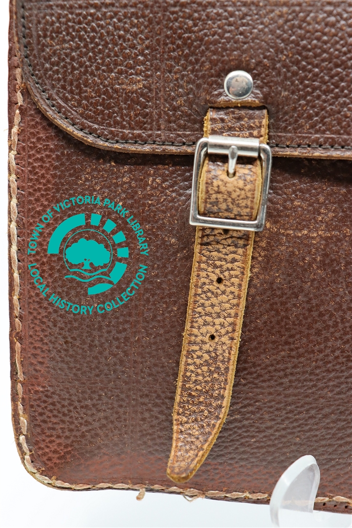 Close-up of buckle on left side of Mr T. Finlayson's leather satchel Image