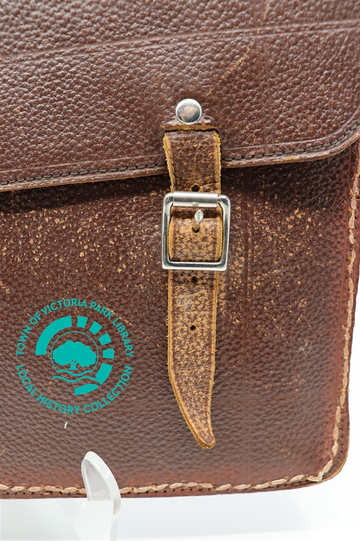 Close-up of right buckle on Mr T. Finlayson's leather satchel Image