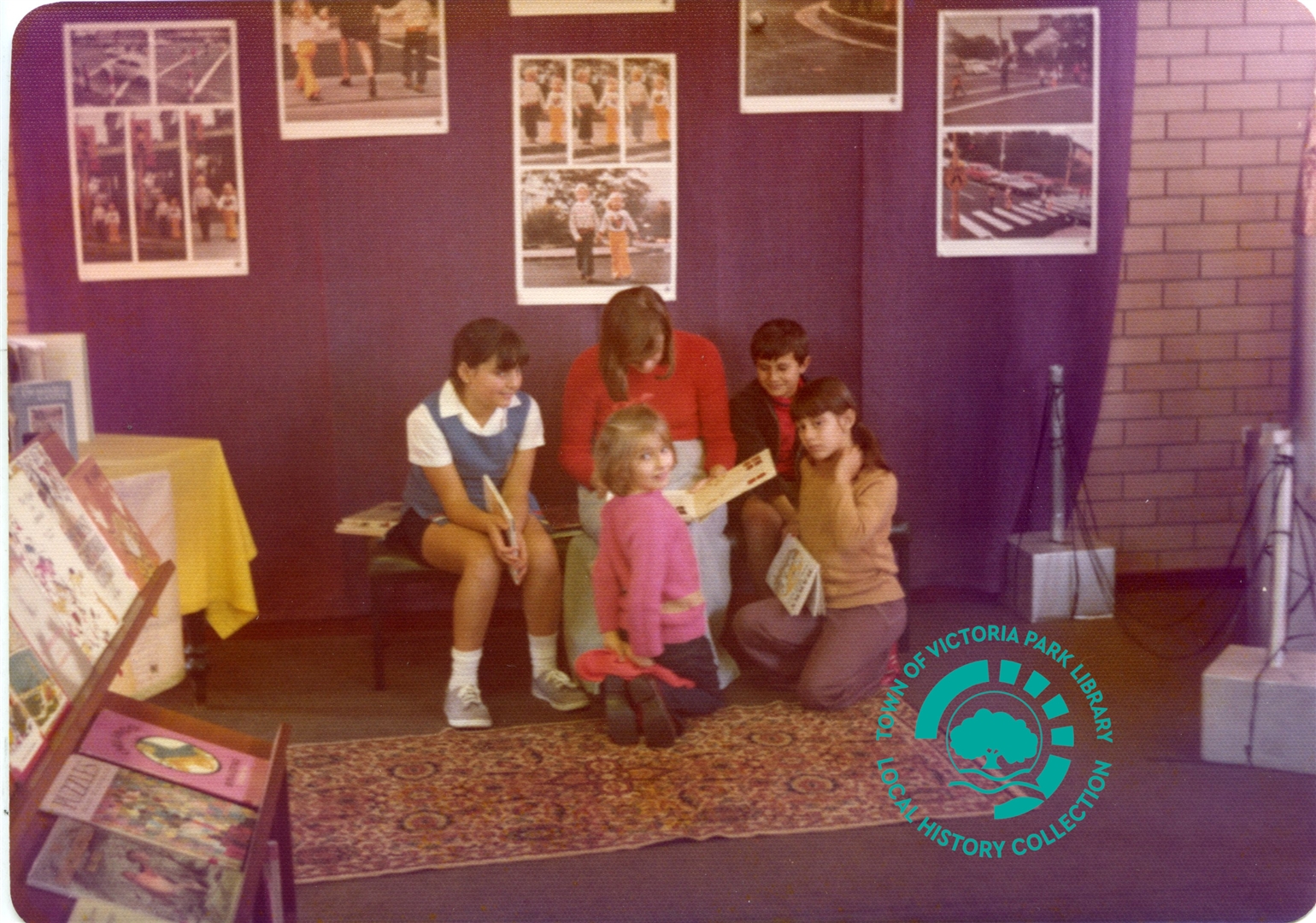 PH00039-06 Lady reading to children in front of display Victoria Park Library (Mint Street) c 1973 1975 Image