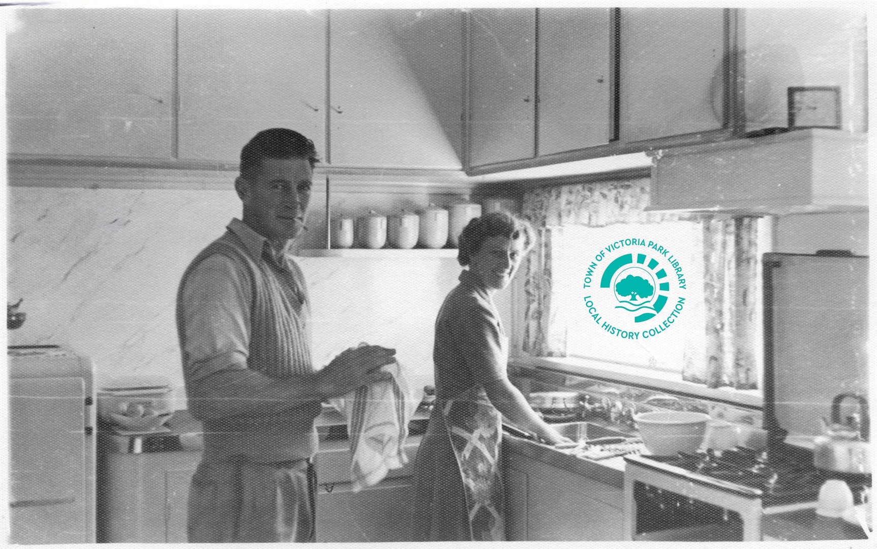 PH00043-09 Ken & Irene Stewart doing dishes, 107 Westminster St, May 1953 Image
