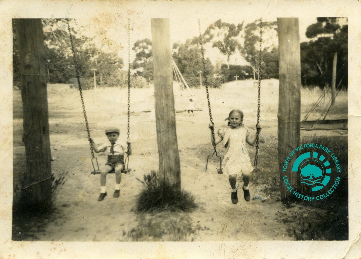 PH00047-04 Eric Brand and his sister,  Marion on swings at Perth Zoo Image