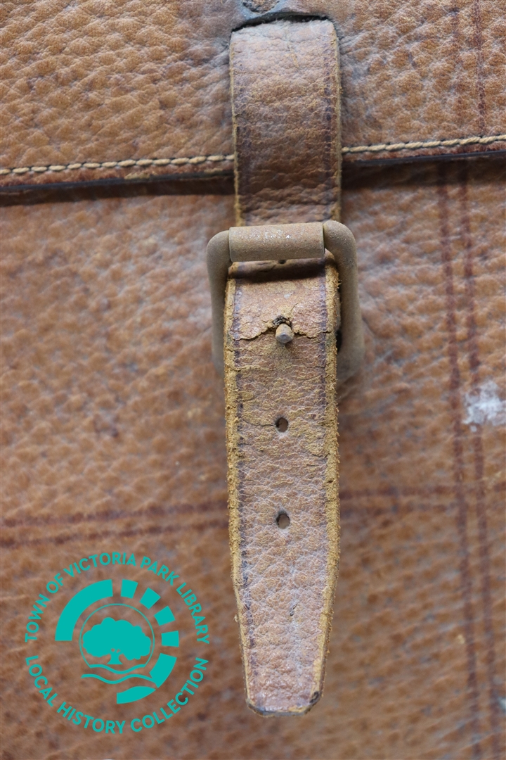 Close-up of right buckle on Mr J Treacy's leather satchel Image