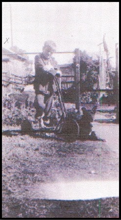 Alec Bell on an old scooter with 'Taffy', circa early 1950s