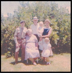 Alec Bell, Robert Bell, Margaret Graham (nee Bell) standing at back, Margaret holding her daughter Robyn with her other daughter Margaret standing at her feet. Florence Bell is seated with her arm around her beloved youngest boy.