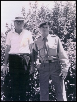 Robert and his son, Private Alec Ernest James Bell in front of the family's lemon tree.